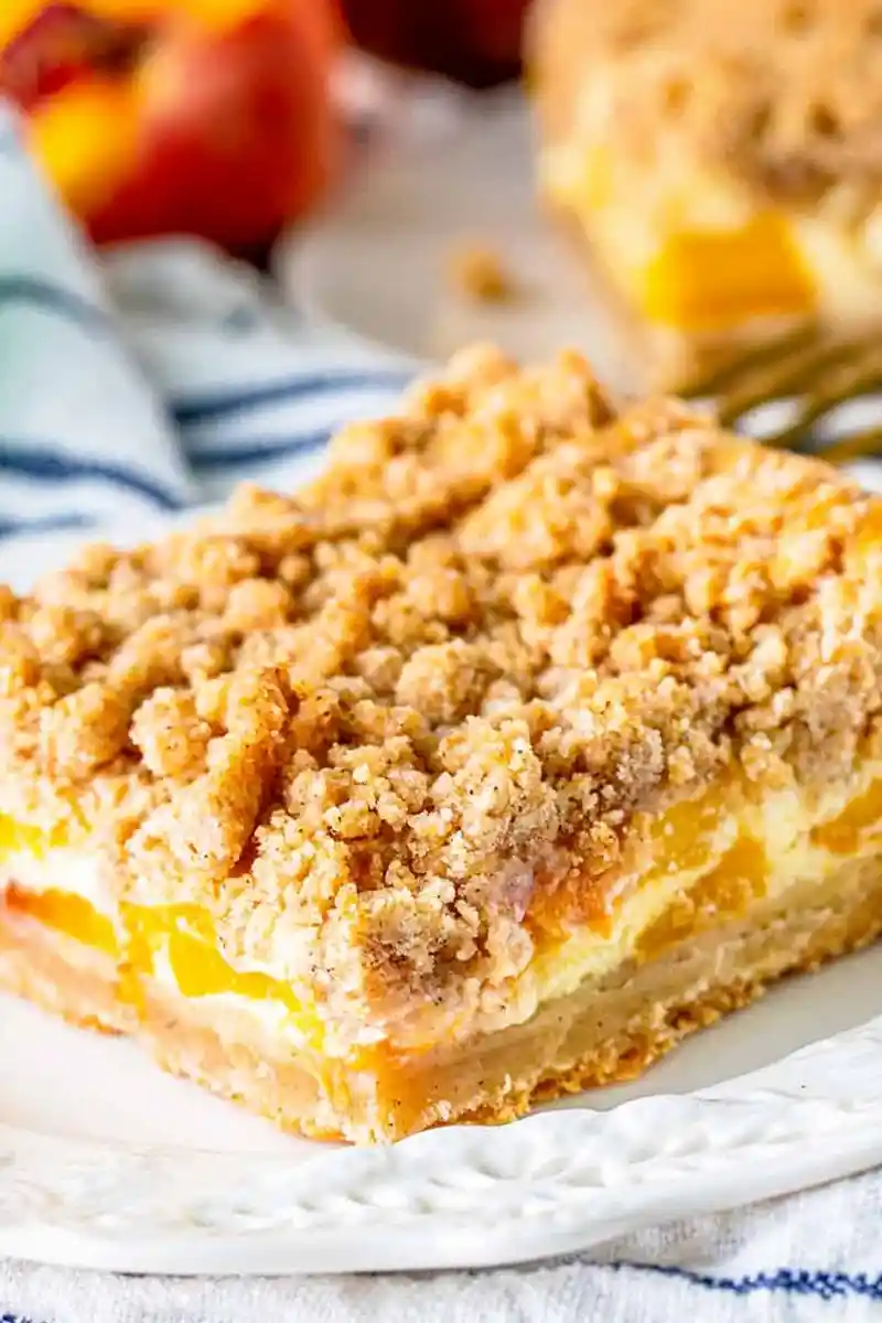 Peach Cobbler Cheesecake Bars 3 Recipe image